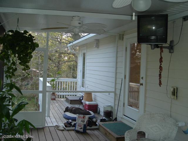 8435 Florence Cove Road St. Augustine, FL 32092 - Photo 6 of 20 a balcony with furniture and a potted plant