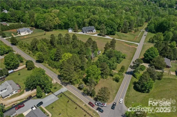 an aerial view of a residential houses with outdoor space