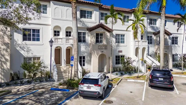 a car parked in front of a houses