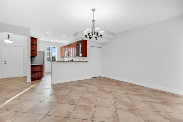 a view of a kitchen with a sink and cabinets