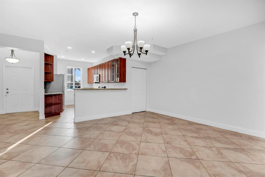 5030 Southwest 126th Avenue, Unit 203 Miramar, FL 33027 - Photo 11 of 41 a view of a kitchen with a sink and cabinets