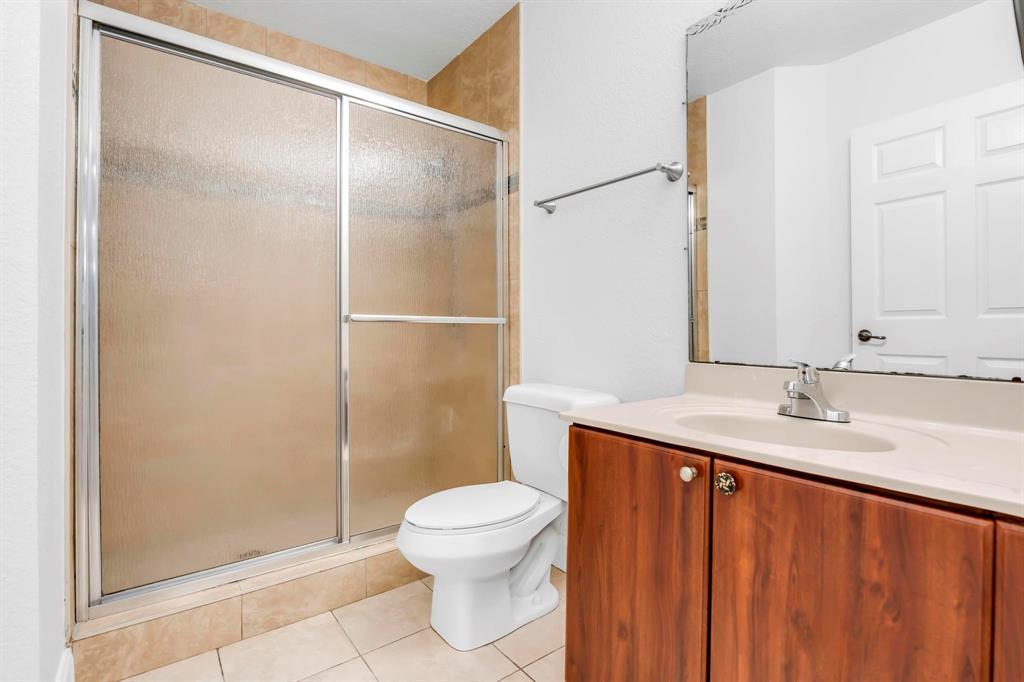 5030 Southwest 126th Avenue, Unit 203 Miramar, FL 33027 - Photo 20 of 41 a bathroom with a granite countertop sink toilet and shower