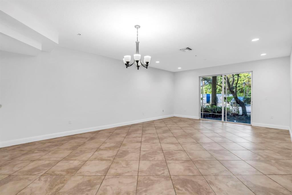 5030 Southwest 126th Avenue, Unit 203 Miramar, FL 33027 - Photo 2 of 41 a view of an empty room with a window