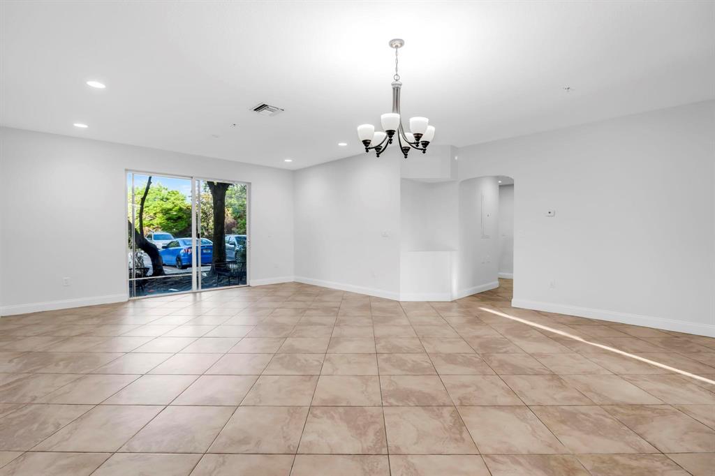 5030 Southwest 126th Avenue, Unit 203 Miramar, FL 33027 - Photo 3 of 41 a view of an empty room with a window