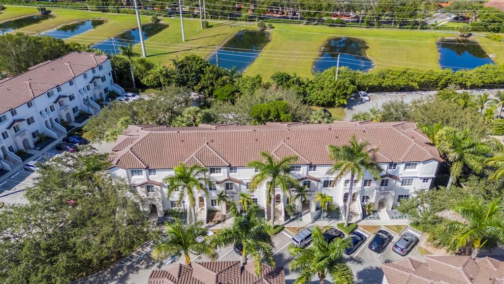 5030 Southwest 126th Avenue, Unit 203 Miramar, FL 33027 - Photo 31 of 41 an aerial view of residential houses with outdoor space and swimming pool