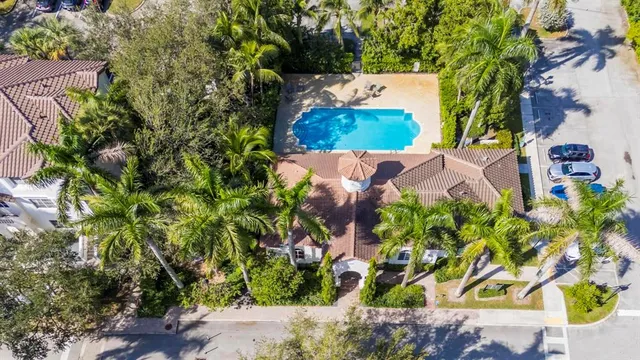an aerial view of residential houses with outdoor space