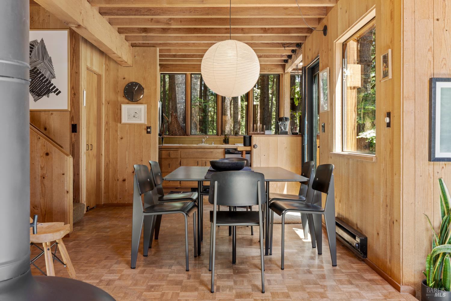 36778 Timber Ridge Road The Sea Ranch, CA 95497 - Photo 23 of 44 a view of a dining room with furniture and a chandelier