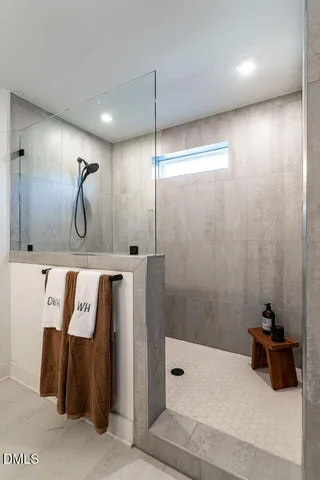 a bathroom with a shower and a tub