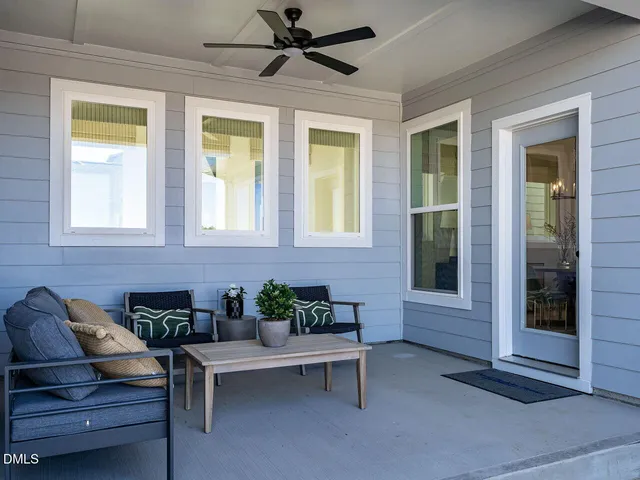 a living room with furniture and windows