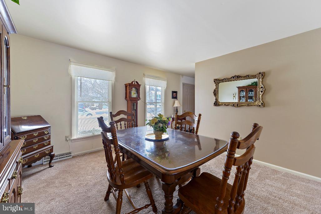 309 Coventry Lane Lititz, PA 17543 - Photo 14 of 28 a view of a dining room with furniture and a potted plant