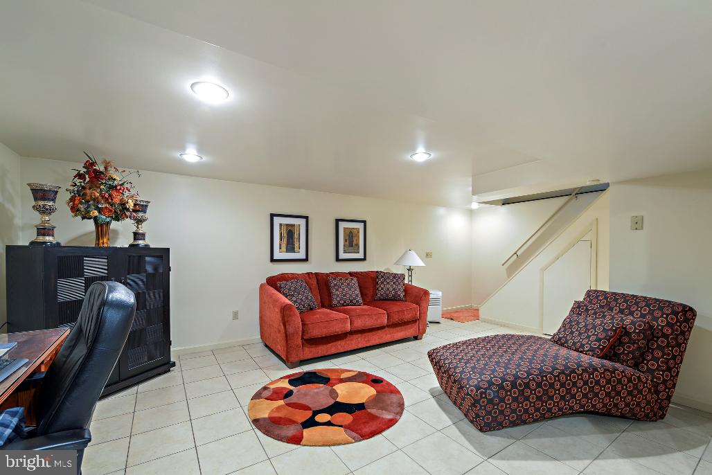 309 Coventry Lane Lititz, PA 17543 - Photo 22 of 28 a living room with furniture and a mirror