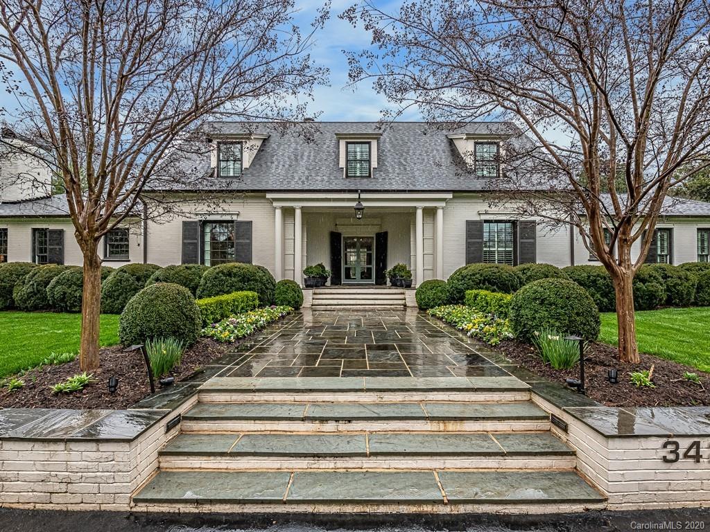 3429 Sharon Road Charlotte, NC 28211 - Photo 2 of 48 a front view of a house with plants and trees