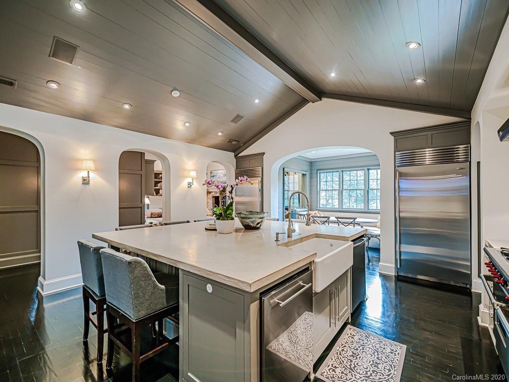 3429 Sharon Road Charlotte, NC 28211 - Photo 14 of 48 a kitchen with a table chairs and refrigerator