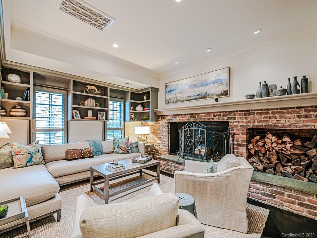 3429 Sharon Road Charlotte, NC 28211 - Photo 22 of 48 a living room with furniture and a fireplace