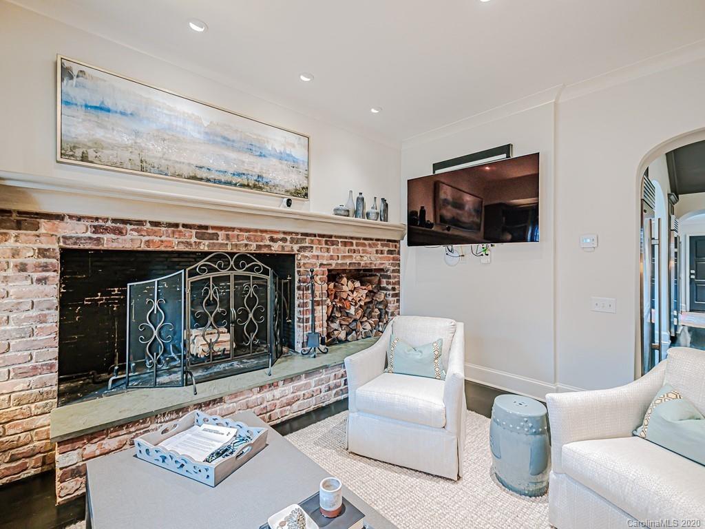 3429 Sharon Road Charlotte, NC 28211 - Photo 23 of 48 a living room with furniture and a fireplace