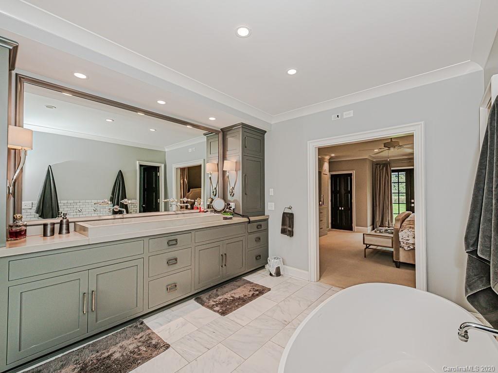 3429 Sharon Road Charlotte, NC 28211 - Photo 30 of 48 a large bedroom with a large bed and a large window