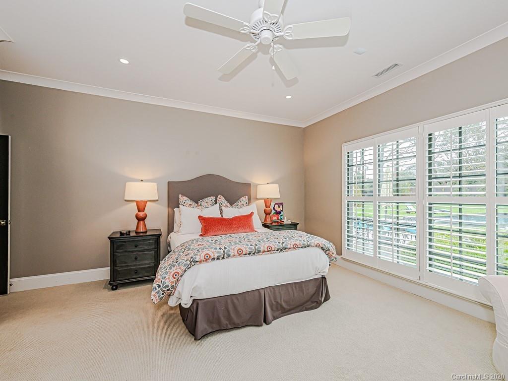 3429 Sharon Road Charlotte, NC 28211 - Photo 31 of 48 a bedroom with a bed and a large window