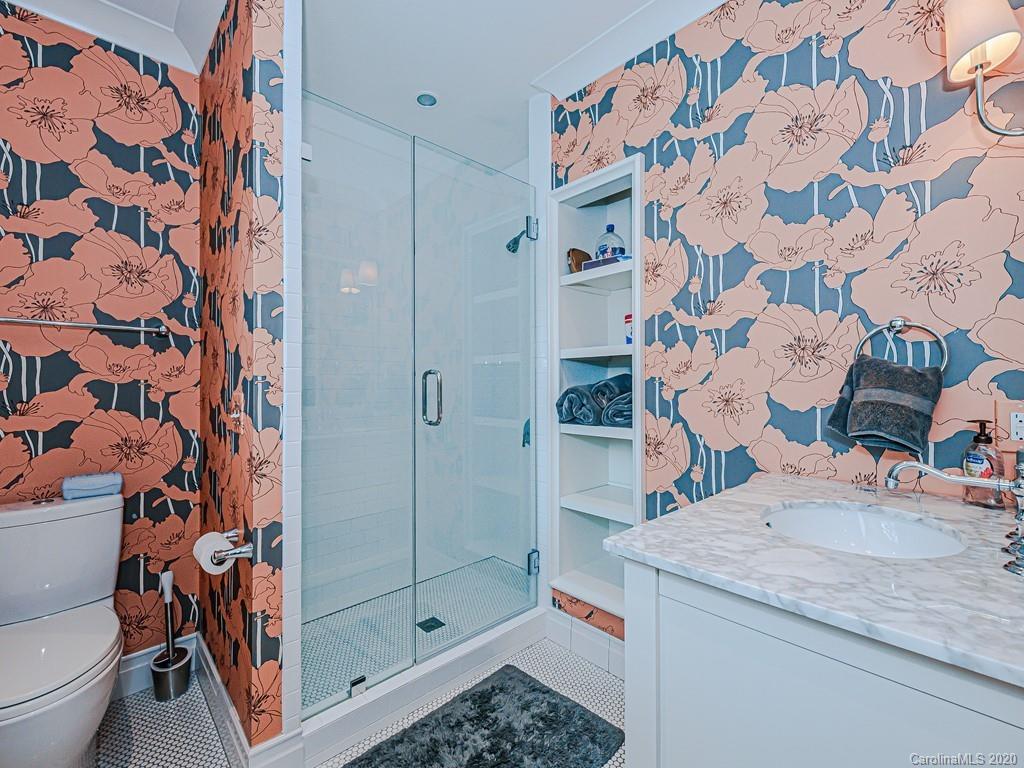 3429 Sharon Road Charlotte, NC 28211 - Photo 32 of 48 a bathroom with a sink toilet and shower