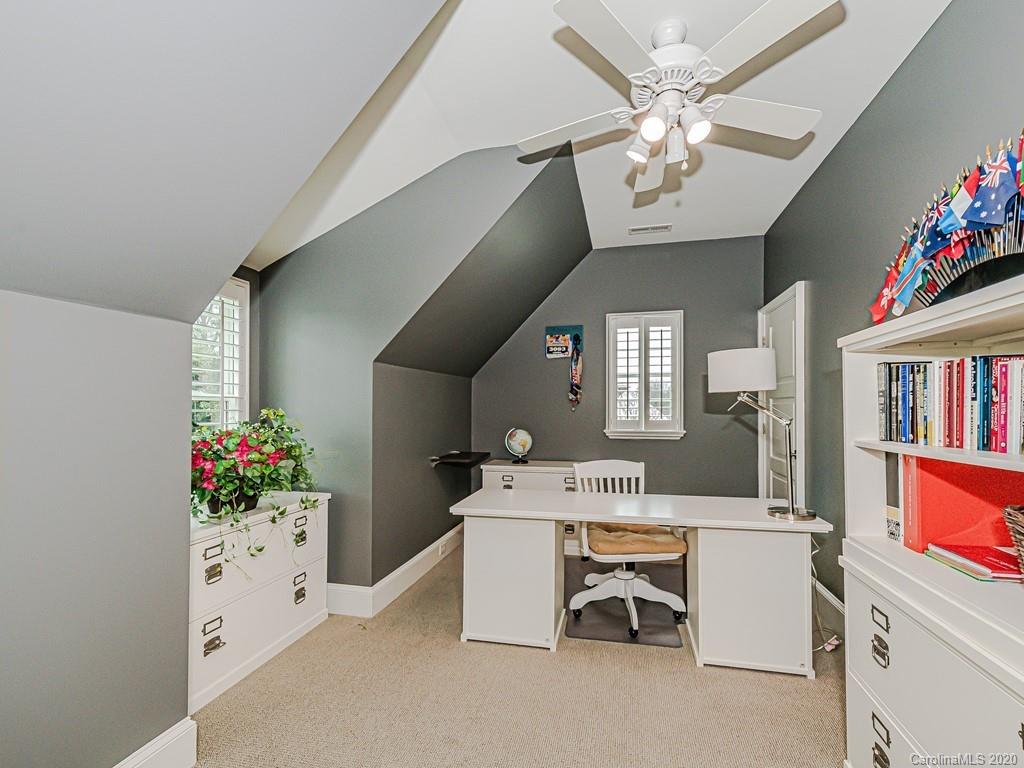 3429 Sharon Road Charlotte, NC 28211 - Photo 38 of 48 a workspace with furniture and white walls