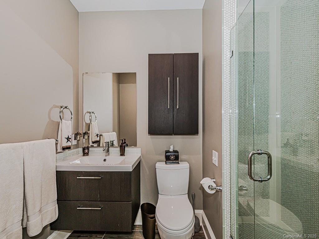 3429 Sharon Road Charlotte, NC 28211 - Photo 39 of 48 a bathroom with a sink toilet and shower
