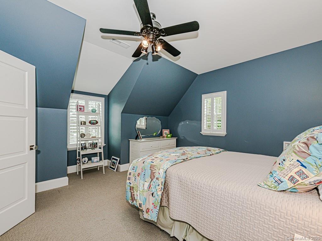 3429 Sharon Road Charlotte, NC 28211 - Photo 40 of 48 a bedroom with a bed and a window