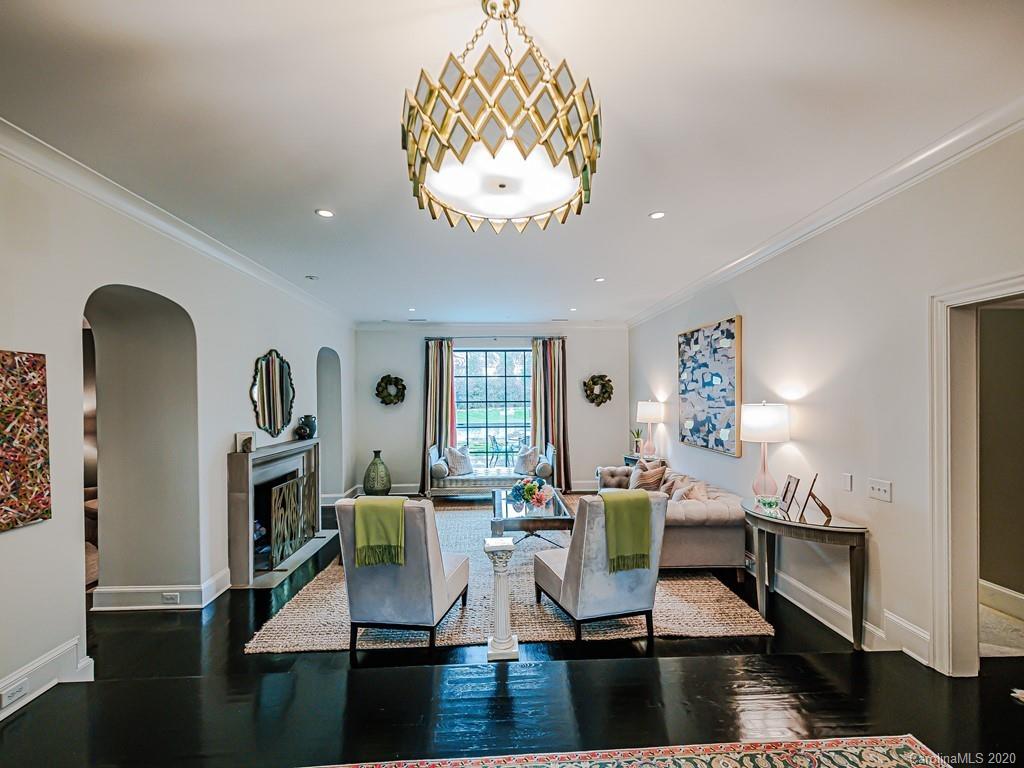 3429 Sharon Road Charlotte, NC 28211 - Photo 5 of 48 a living room with furniture and a chandelier