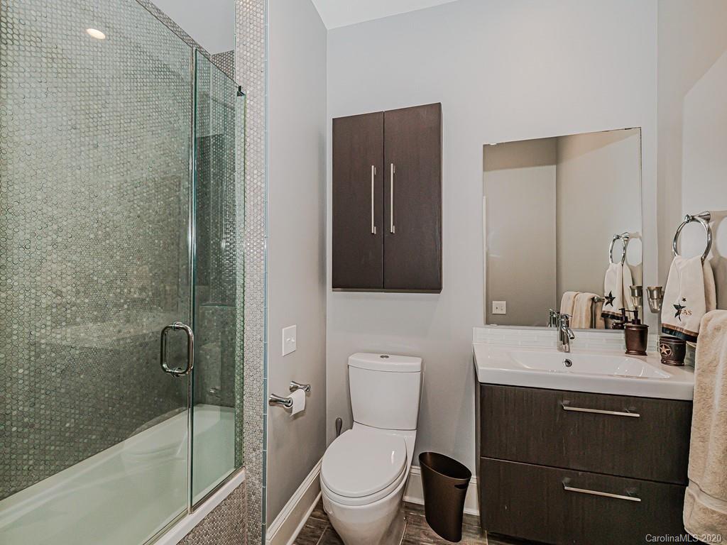3429 Sharon Road Charlotte, NC 28211 - Photo 42 of 48 a bathroom with a sink toilet and shower