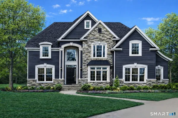 front view of brick house with a yard