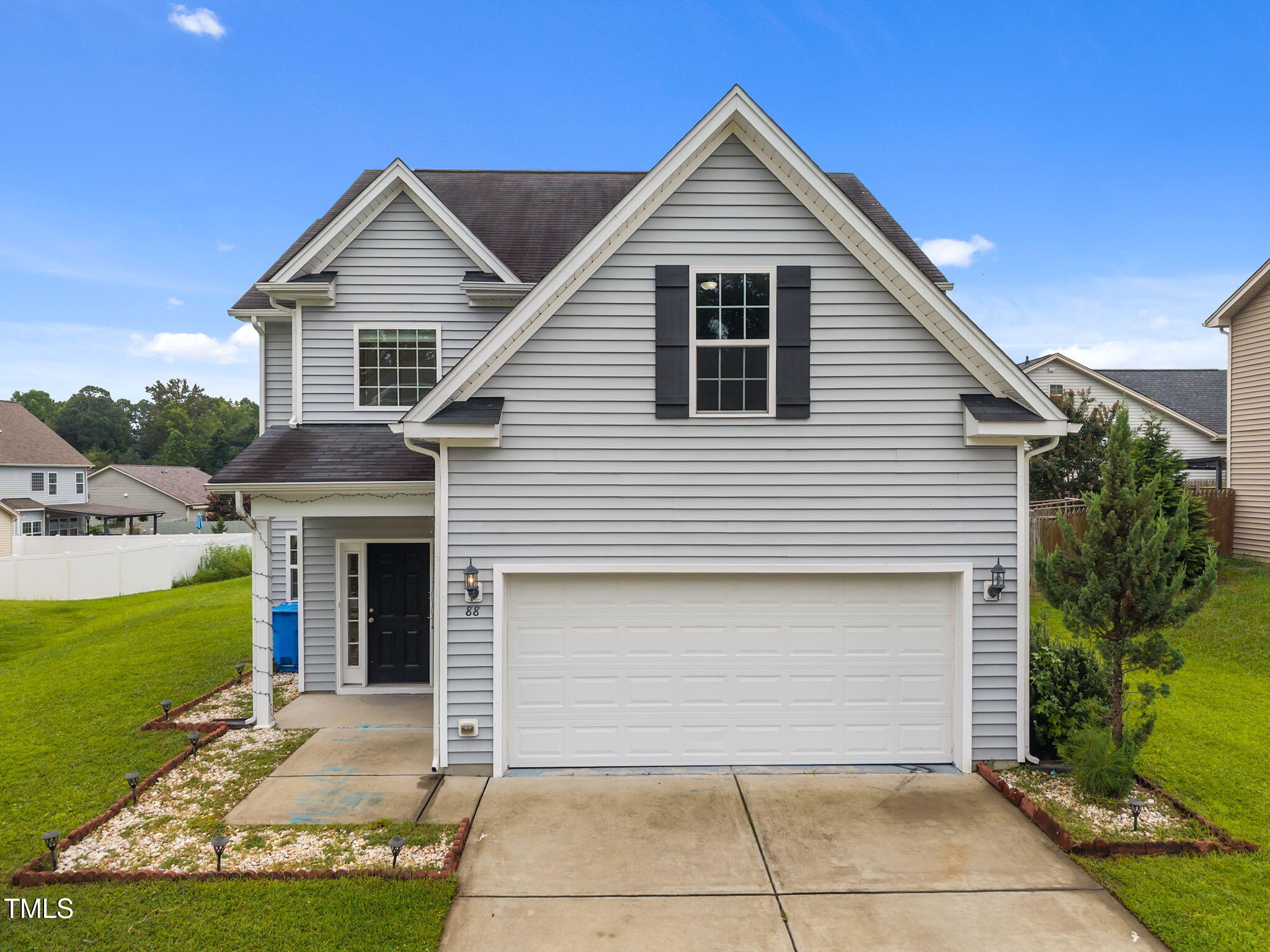 88 Arbor Loop Angier, NC 27501 - Photo 2 of 36 a front view of a house with a yard