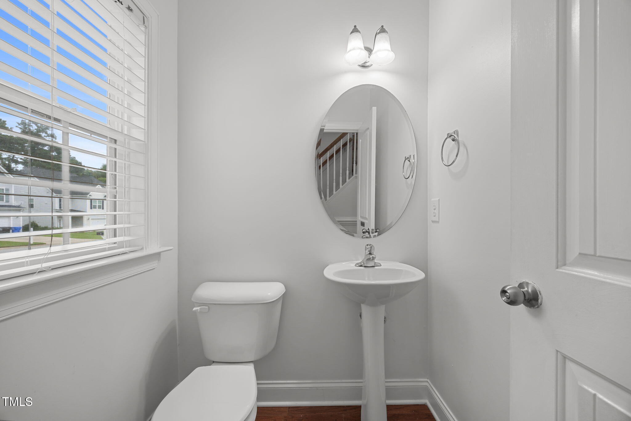 88 Arbor Loop Angier, NC 27501 - Photo 21 of 36 a bathroom with a toilet sink and mirror