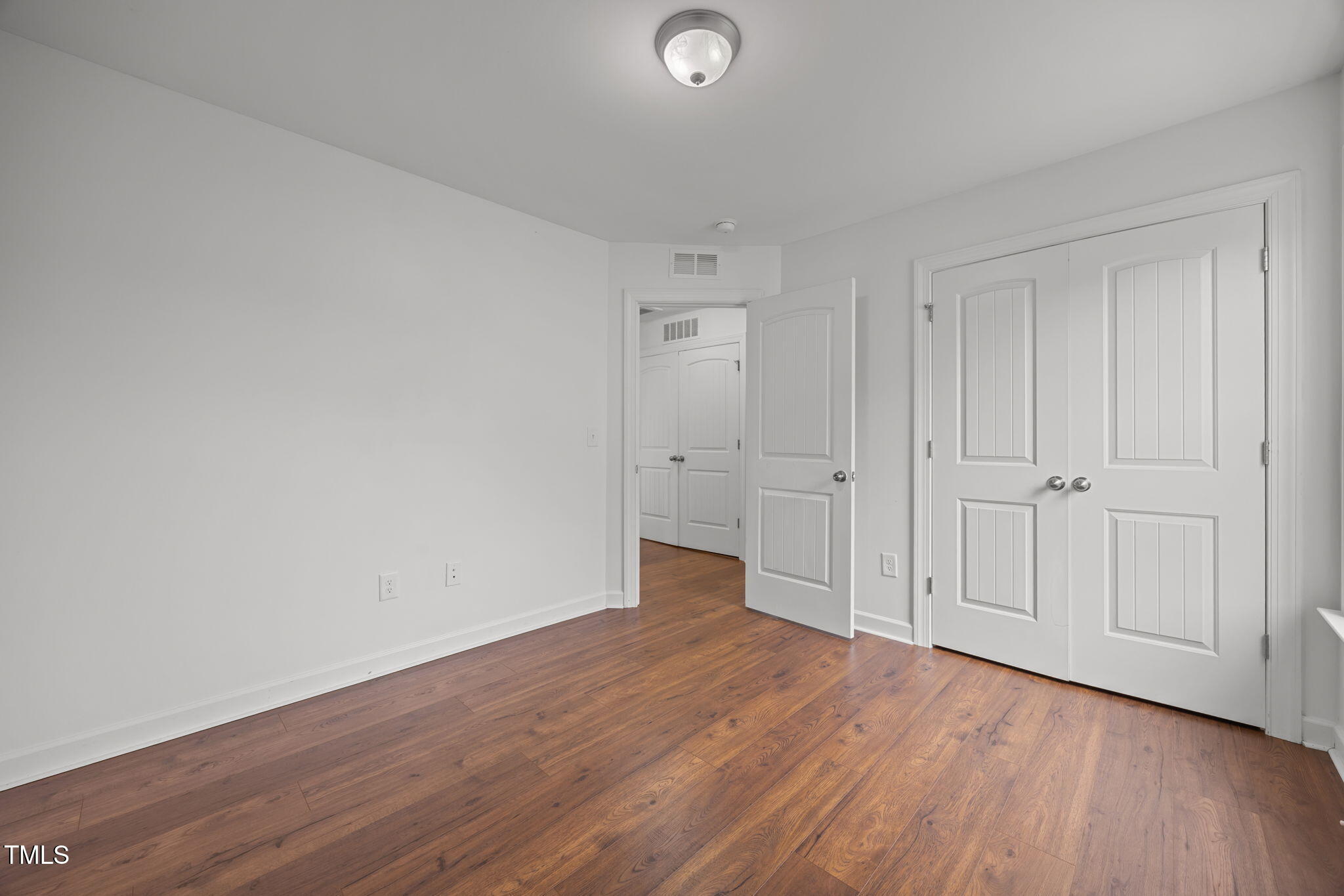 88 Arbor Loop Angier, NC 27501 - Photo 23 of 36 a view of an empty room with wooden floor
