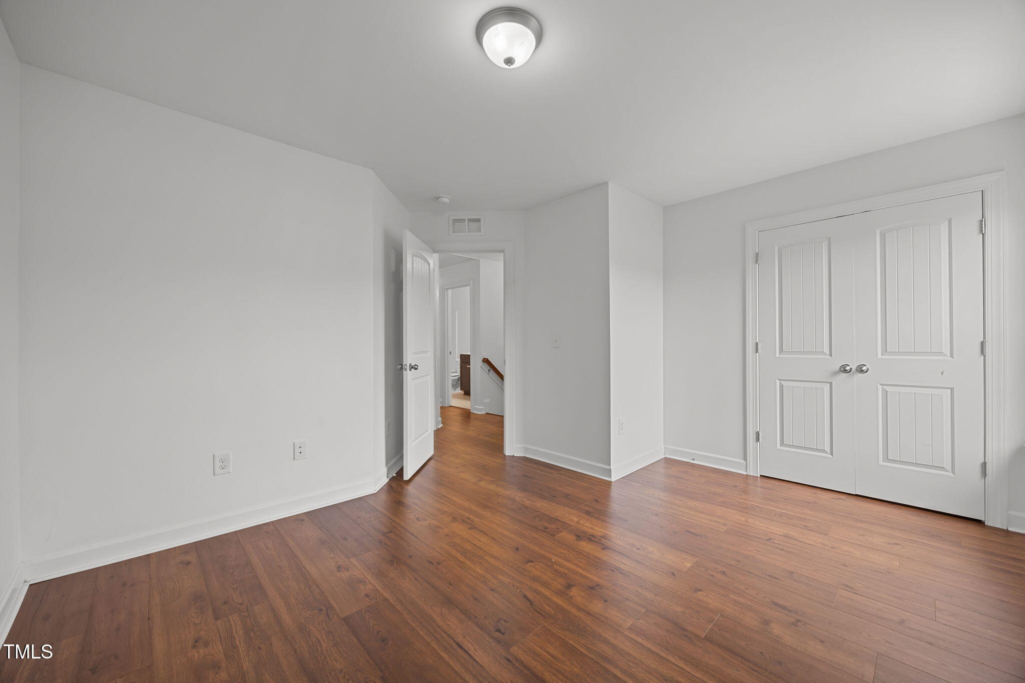 88 Arbor Loop Angier, NC 27501 - Photo 24 of 36 a view of an empty room and wooden floor
