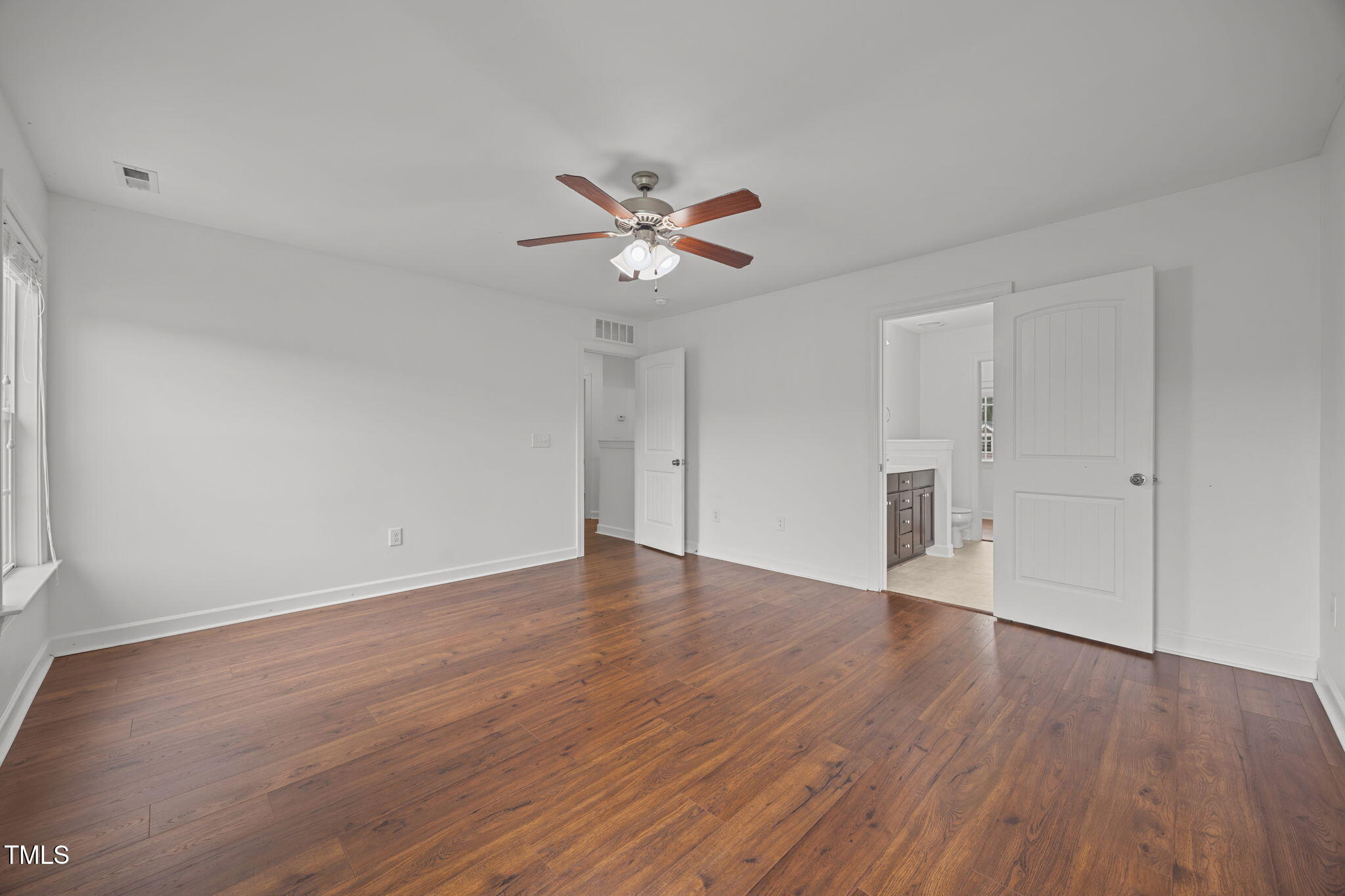 88 Arbor Loop Angier, NC 27501 - Photo 27 of 36 a view of an empty room with wooden floor