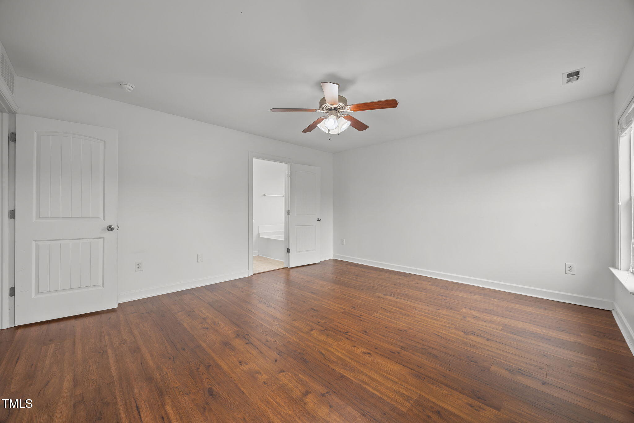88 Arbor Loop Angier, NC 27501 - Photo 28 of 36 wooden floor in an empty room with a window