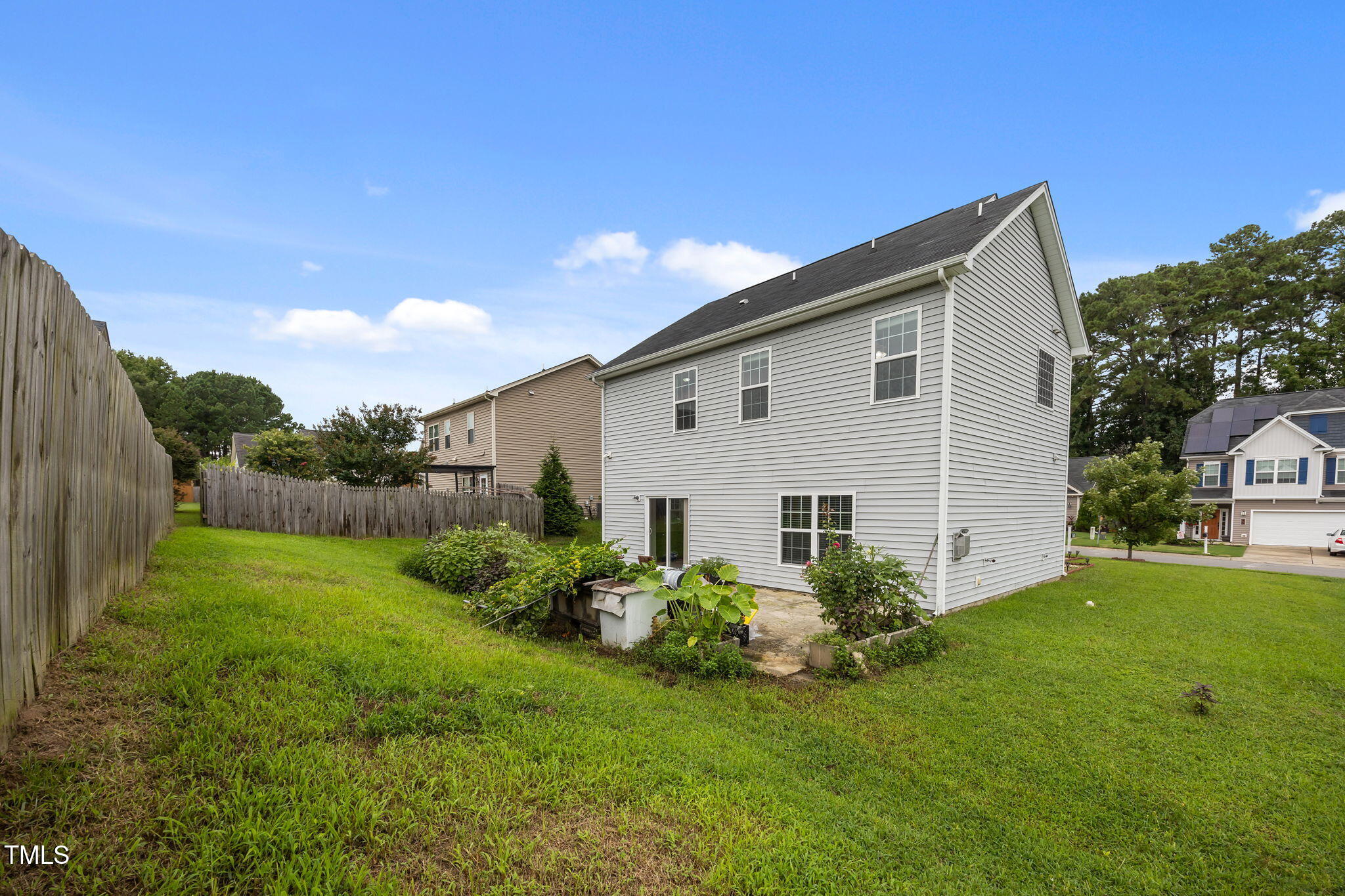 88 Arbor Loop Angier, NC 27501 - Photo 32 of 36 a view of a house with a yard