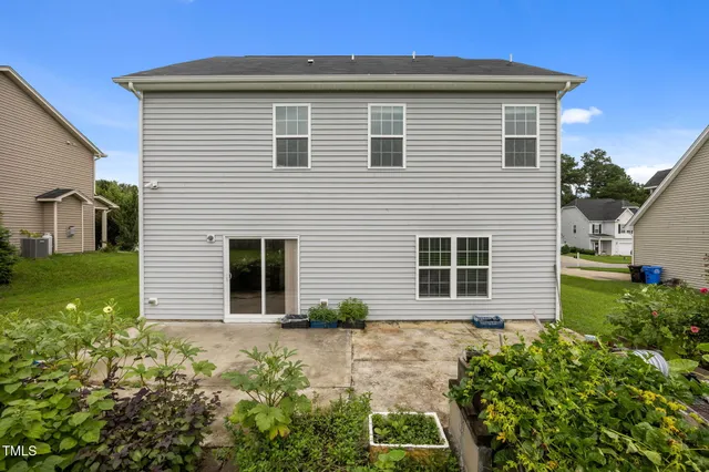 swimming pool view with a garden