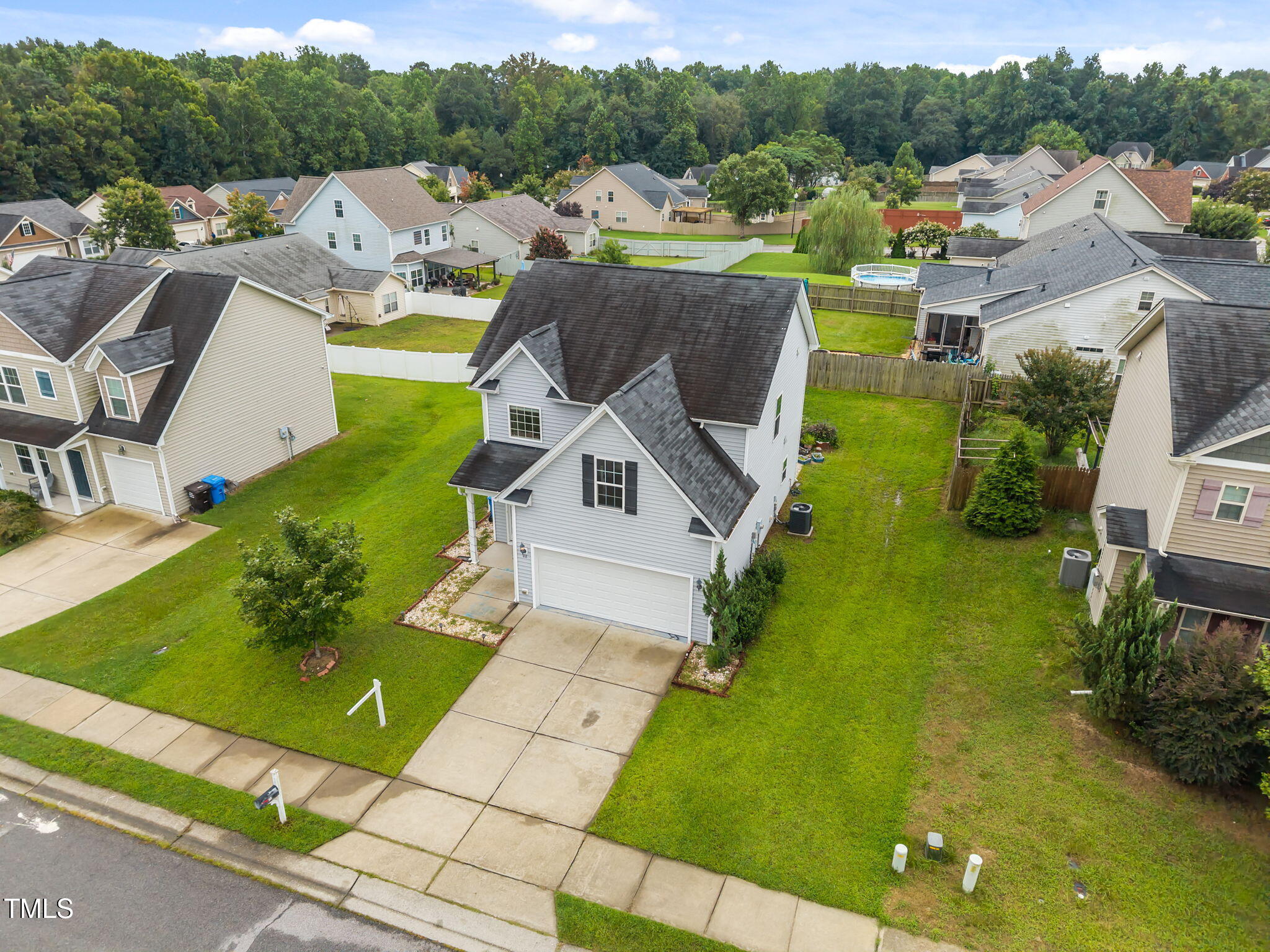 88 Arbor Loop Angier, NC 27501 - Photo 4 of 36 a view of a house with a big yard