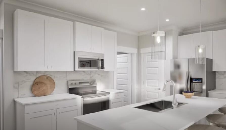 196 Huckleberry Street Freeport, FL 32439 - Photo 13 of 20 a kitchen with stainless steel appliances a refrigerator a sink a stove and white cabinets