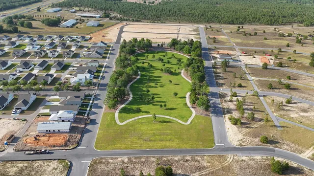 an aerial view of residential houses with outdoor space
