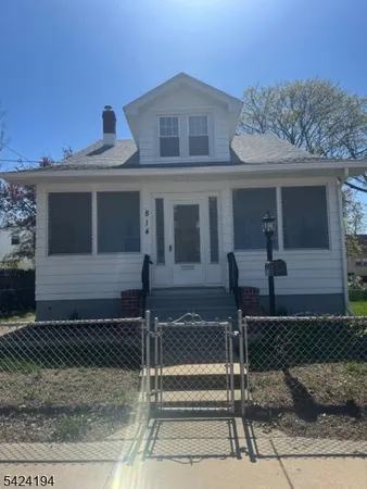 a front view of a house with stairs