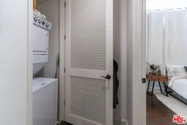 a bathroom with a toilet and a shower curtain