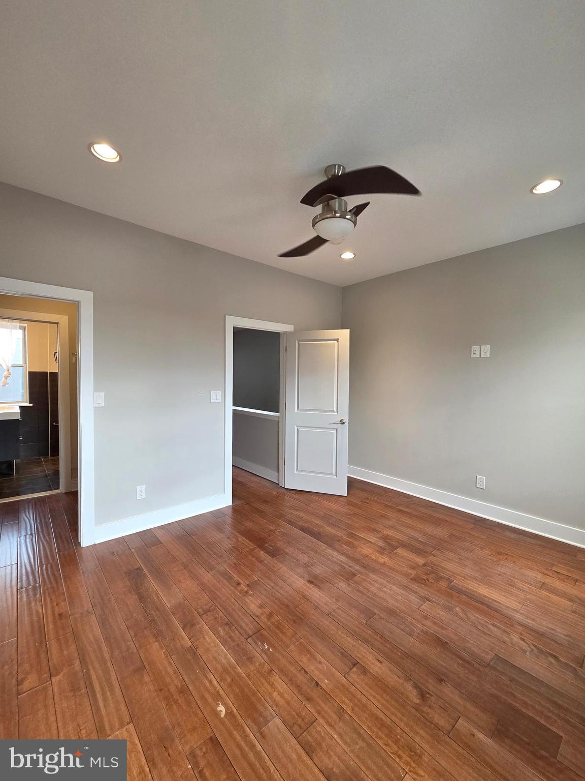 1603 Ellsworth Street, Unit B Philadelphia, PA 19146 - Photo 30 of 43 a view of an empty room with wooden floor and a window