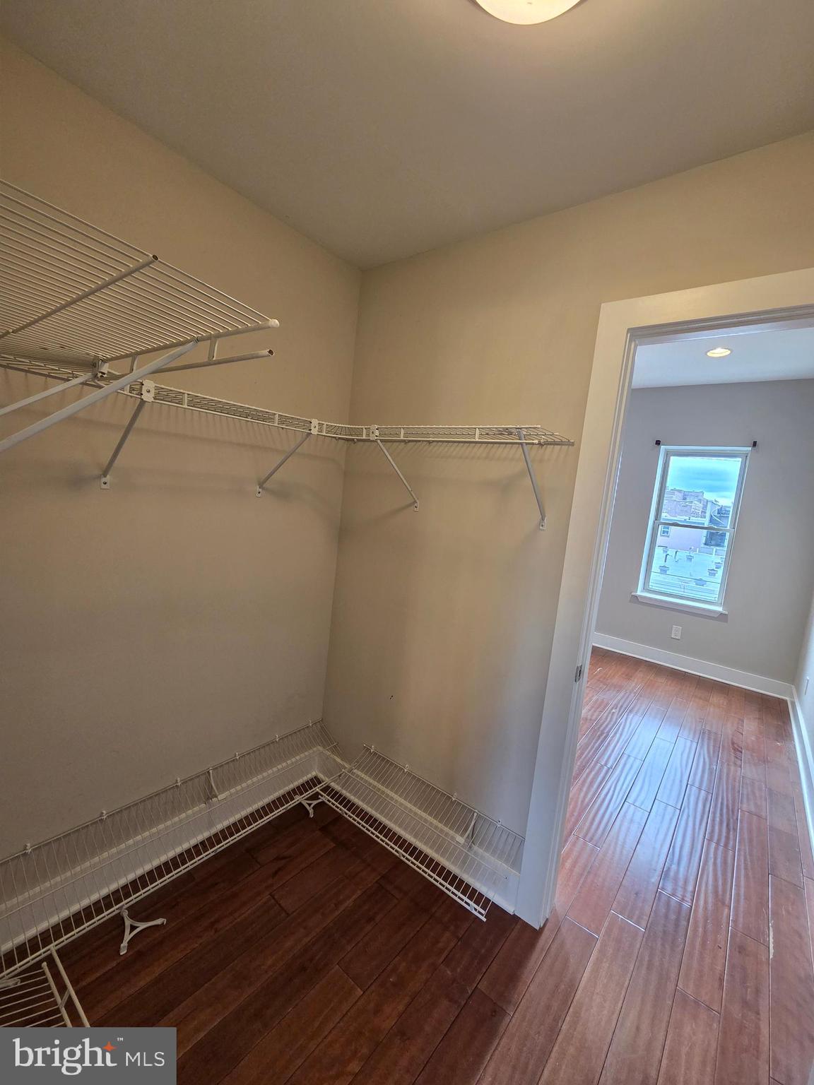 1603 Ellsworth Street, Unit B Philadelphia, PA 19146 - Photo 32 of 43 a view of a room with wooden floor and white walls