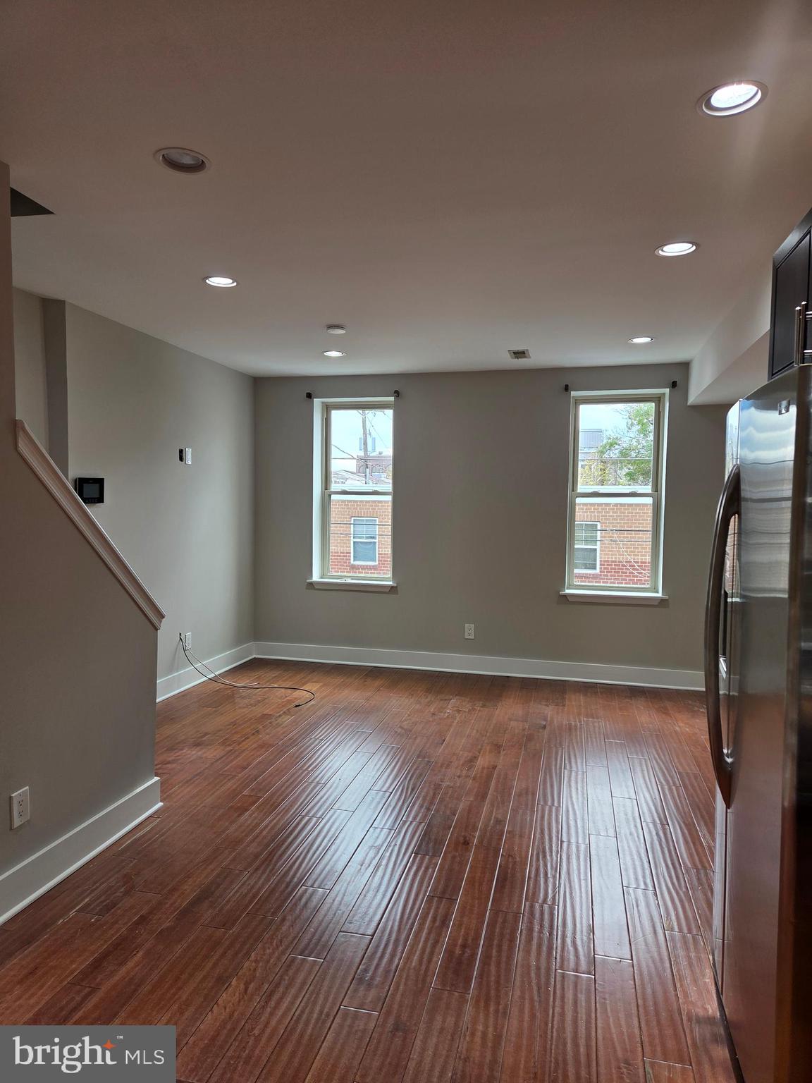 1603 Ellsworth Street, Unit B Philadelphia, PA 19146 - Photo 8 of 43 a view of empty room with wooden floor and fan