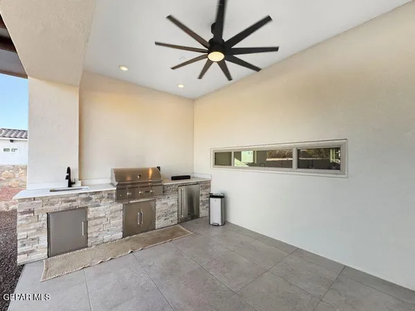 a kitchen with a sink cabinets and appliances