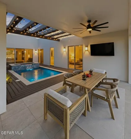 a view of a patio with a table chairs and a table