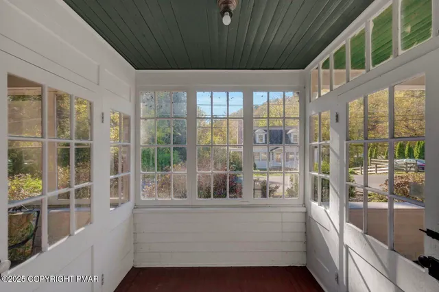 a kitchen with granite countertop a refrigerator a sink a stove and cabinets