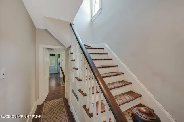 a kitchen with granite countertop a sink a stove and cabinets