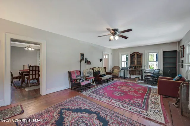 a bedroom with furniture and wooden floor