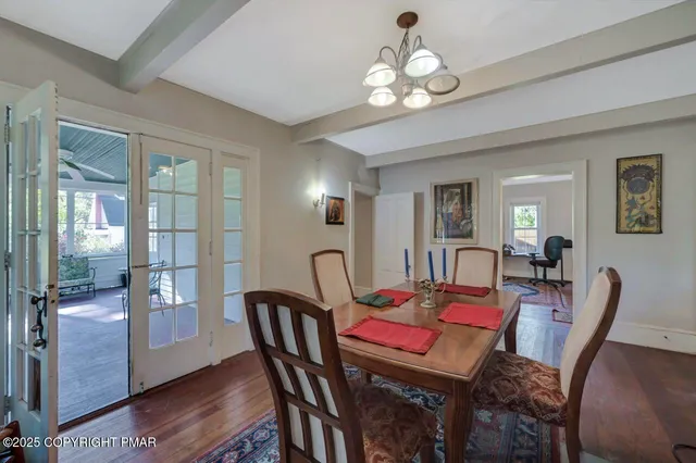 a living room with furniture and a book shelf